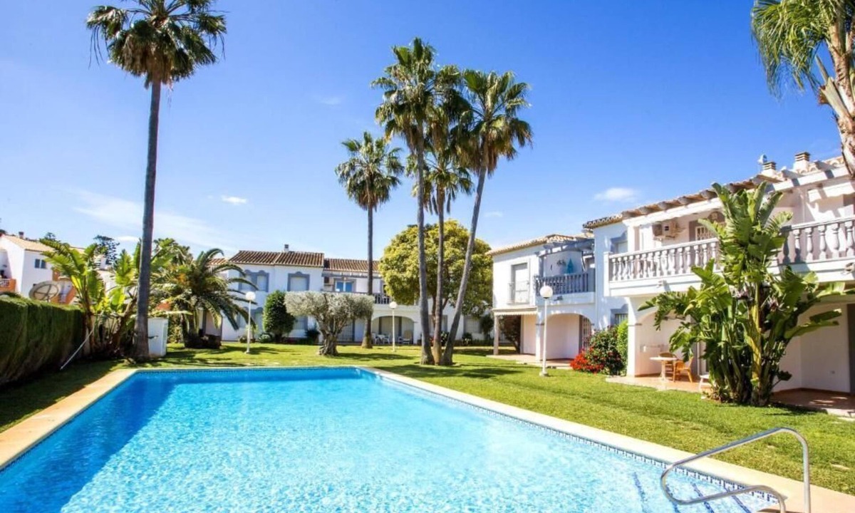 Denia House | Family sized Townhouse with Shared Pool. 5 minutes walk from beach and shops.