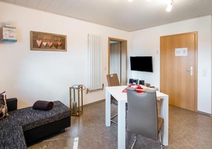 Cosy apartment with terrace and garden access in a quiet wooded area