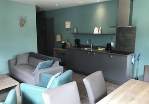 Relax wonderfully, and into an apartment with a view of the slopes/mountains.