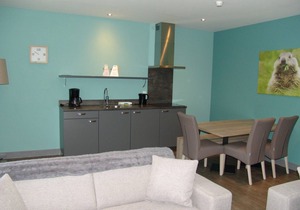 Relax wonderfully and into an apartment with a view of the slopes/mountains.