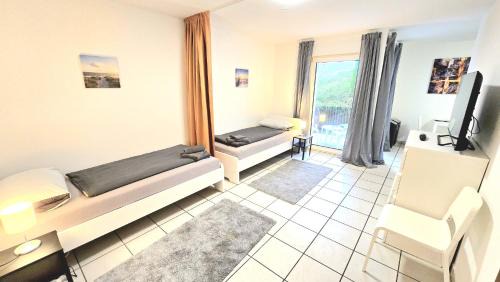 Menden Apartment | Apartment mit 2 Einzelbetten, Terrasse, Parkplatz, WLAN, voll ausgestattet - Monteurwohnung MF01