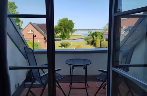 Mellenthin Apartment | Apartment 'WE6 Ferienwohnung Seeadler' Balcony with View of the Achterwasser
