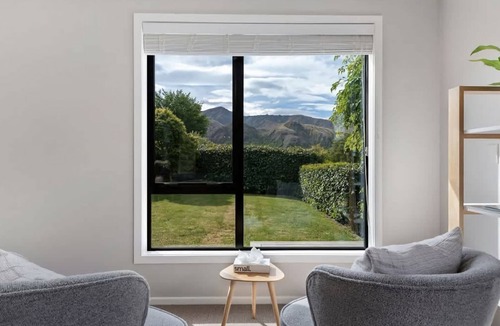 Arrowtown House | Arrowtown Charm is a cosy retreat blending rustic character and modern comfort in the heart of town.