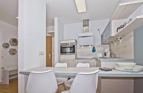Gohren Apartment | Balcony, free use of the AHOI adventure pool and sauna - Villa Karola FeWo 04