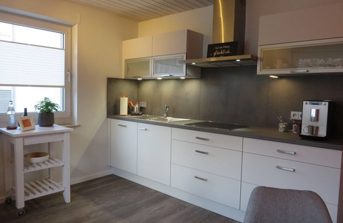 Grossheubach Apartment | Cozy vacation apartment (80 m2) with wooden terrace and sunbathing lawn
