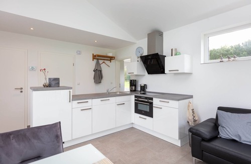 Schuettorf House | Holiday Home 'Haus 21 am See' with Large Grounds, Private Terrace, Garden & Wi-Fi