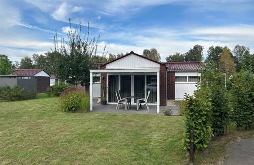 Schuettorf House | Holiday Home 'Haus 21 am See' with Large Grounds, Private Terrace, Garden & Wi-Fi