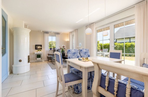 Dranske House | "Küstenperle" Vacation Home in Dranske – enjoy a dream vacation with a breathtaking view of the Bodden and the Baltic Sea. Child-friendly amenities, as well as a wellness area with a sauna and hot tub.