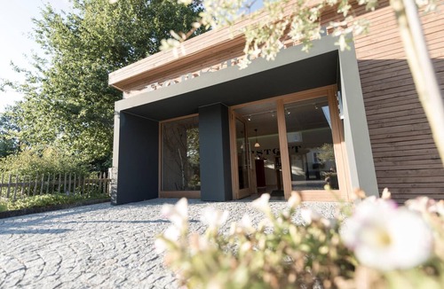 Regen Apartment | Luxury chalet with a balcony, hot tub, and sauna