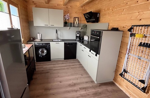 Lisberg House | Modern log cabin with sauna, natural views, and chalet charm