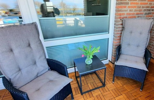 Orth Apartment | Relax in harbor bliss: dream holiday apartment with sea view on Fehmarn