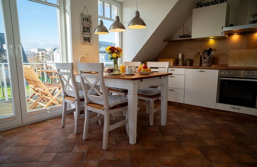 Boergerende-Rethwisch Apartment | Spacious apartment with balcony, garden view and partial sea view in Börgerende