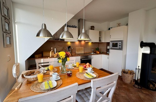 Boergerende-Rethwisch Apartment | Spacious apartment with balcony, garden view and partial sea view in Börgerende