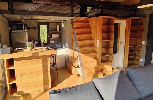 Buhlau House | Spectacular tiny house in a pond with terrace and fireplace