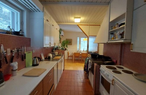 Sinetta Cottage | Traditional Lapland Cottage with fireplace & glass room for aurora hunting