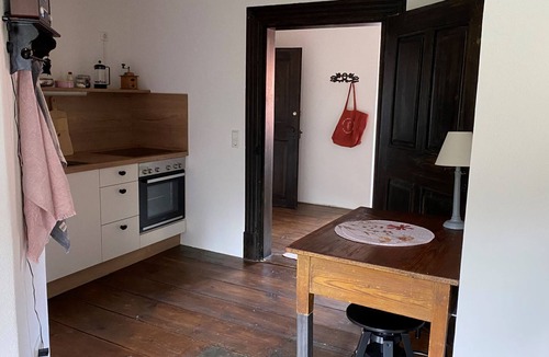 Bastheim Apartment | Unique vacation apartment with a view over the monastery grounds and the romantic garden (60sqm)