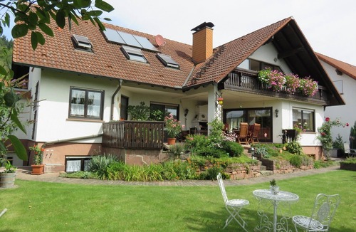 Grossheubach Apartment | Vacation apartment "Engelbergblick" with large panoramic window and balcony| 4 stars