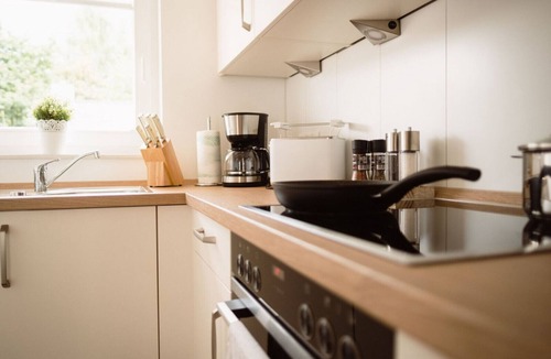 Nordhorn House | Vacation home Vechtestrand with 72 m² living space in Nordhorn. First-class living comfort with sauna, whirlpool, fireplace & air conditioning. Sunny terrace with patio furniture and parasol. Washing machine