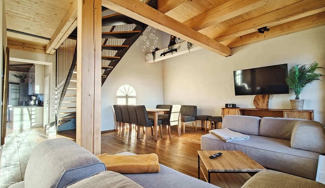 A stylish penthouse flat with a whirlpool bath, a fireplace and a massage chair