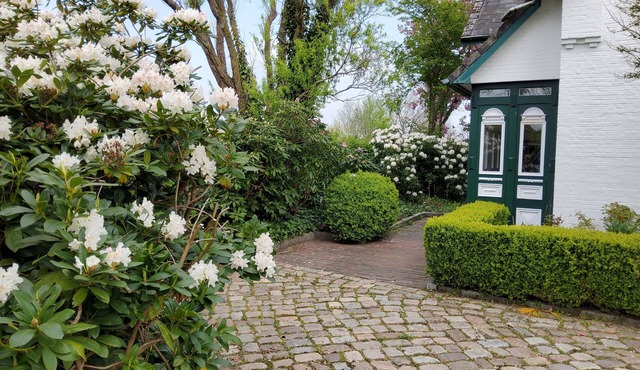 Built in 1920, a house with a two-story sunroom, just a short drive from the North Sea