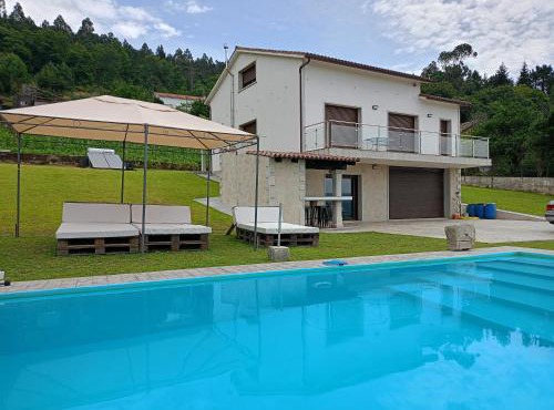 Casa con piscina climatizada