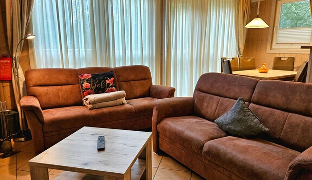 Gabi's Vacation Home 68d in Baabe with a view of the sea. A relaxing break with a sauna and hot tub. A welcoming patio with patio furniture and a grill for social gatherings. Lockable bike storage area