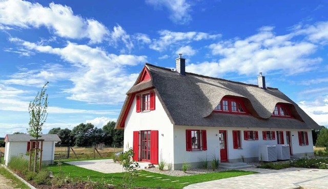 Haus zwischen Mühle und Meer