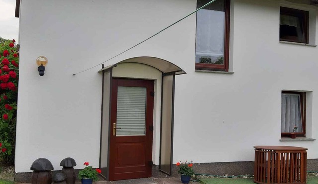 Holiday home with children's swing and barbecue facilities
