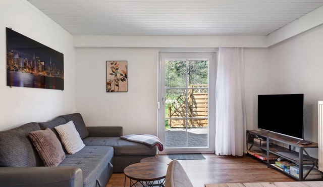 Idyllic Apartment at the Forest Edge with Private Terrace, Shared Garden, and Wi-Fi