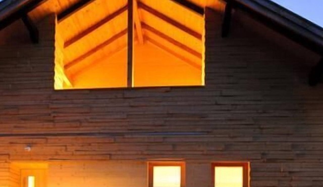 Luxury chalet with a balcony, hot tub, and sauna