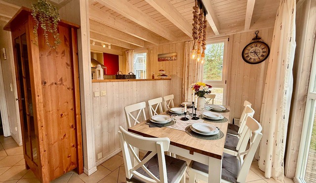 "Meeresblume 206" Vacation Home in Baabe. Cozy evenings by the fireplace and a relaxing break with a sauna and hot tub. A sunny terrace for enjoyable breakfast moments. Travel Crib & High Chair