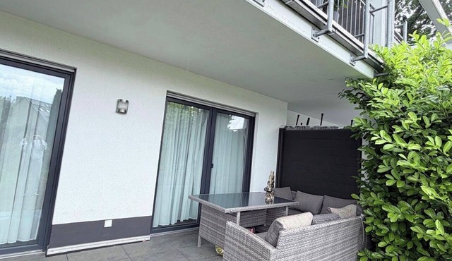 Modern, fully furnished new-construction apartment with a terrace in a quiet location