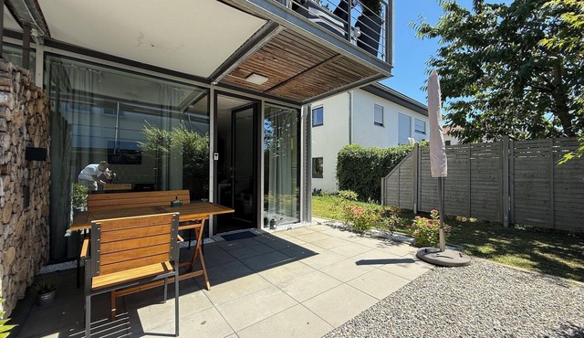Modern See und Mehr Apartment 3 with covered terrace and garden view