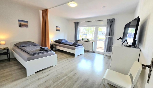 Moderne Monteurwohnung mit Balkon, Einzelbetten, voll ausgestattet, kostenloser Parkplatz & WLAN in Hagen - HL01