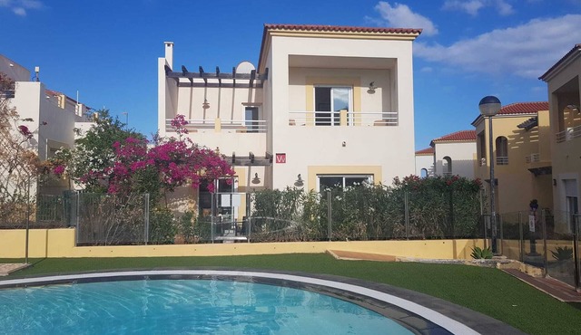 Poolside villa with private access from terrace in secure gated community.