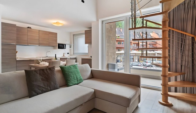 Spacious family loft near Comano Thermal Baths, ideal for 4–6 guests with balcony and garage