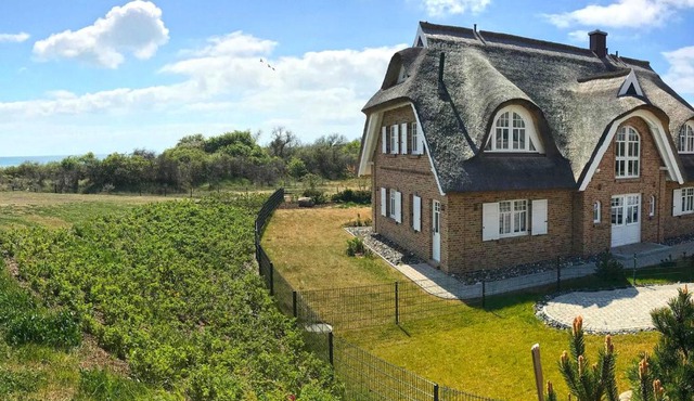 Strandhaus 6 "Düne" in Lobbe mit Meerblick, Kamin, Sauna