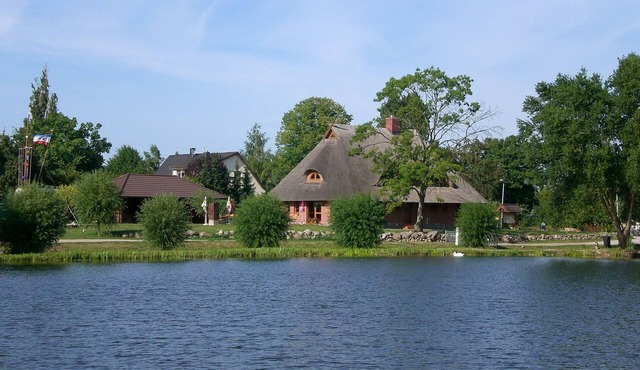Vacation apartment directly at the fishing pond with parking lot and terrace