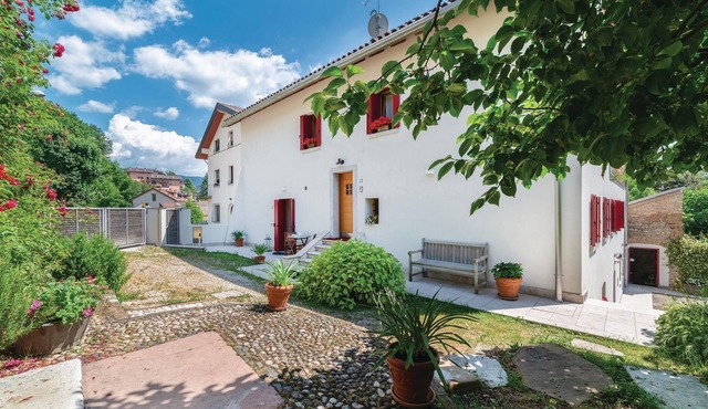 Vacation apartment in Belluno with shared garden.