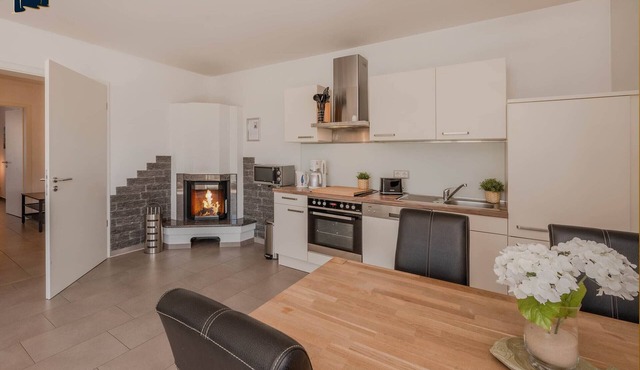 Vacation apartment with garden view, fireplace and balcony on Lake Wolgastsee