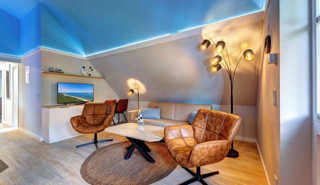 Vacation apartment with private sauna and fireplace, right on the beach.