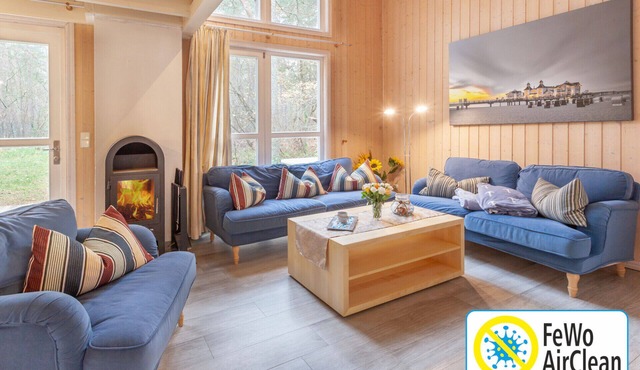 Vacation Home "Haus am Meer 283" in Baabe. Awarded the FeWoAirClean seal. Idyllic location in a pine forest with a balcony and terrace. Cozy evenings by the fireplace and soothing relaxation in the sauna