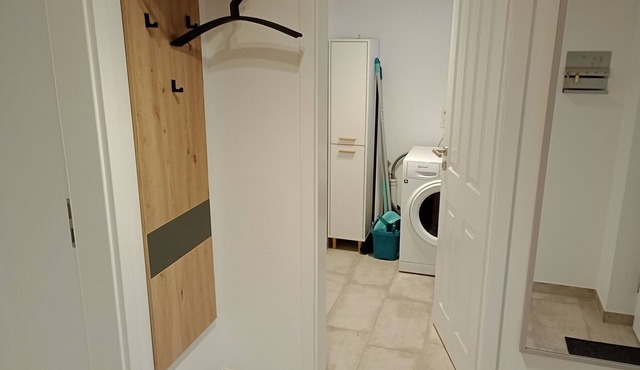 Vacation home Ida with 86 m² living space in Nordhorn. Stylish oasis of relaxation with sauna, whirlpool & cozy fireplace. Terrace with comfortable seating area and comfortable garden furniture and garden shed