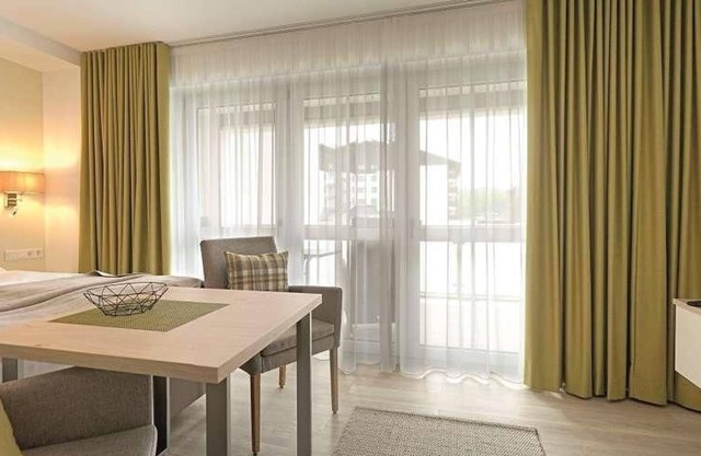 Vacation home with box-spring bed and south-facing balcony
