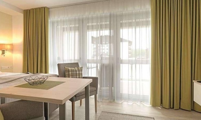 Bad Fuessing Apartment | Vacation home with box-spring bed and south-facing balcony